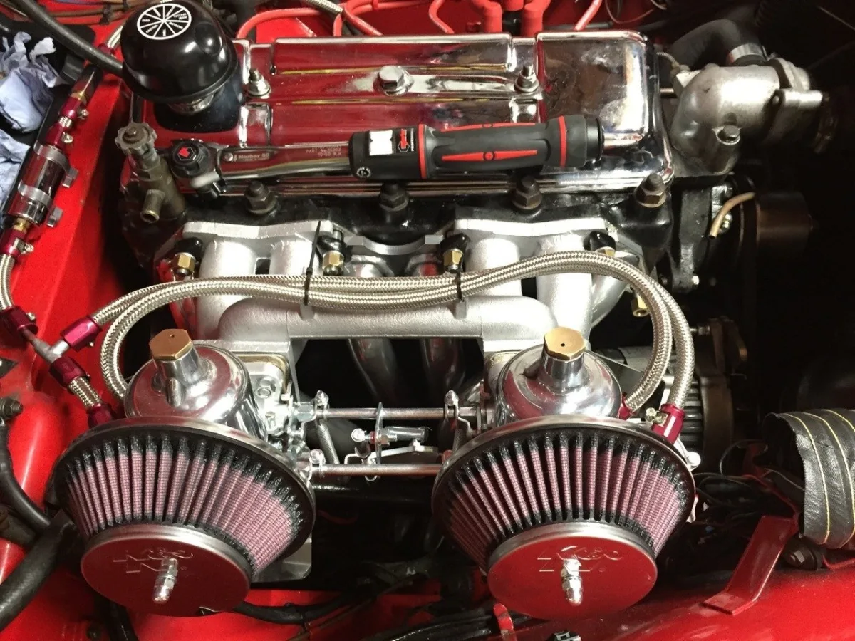 Engine bay with twin carburettors and polished rocker cover